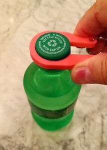 12 Water / Soda Bottle cap easy opener keychains.  Opens Tight bottle caps.