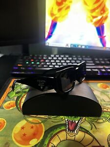 Prada Sunglasses Black / Dark Grey Lens