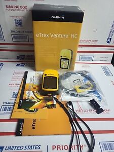 Garmin eTrex Venture HC Handheld GPS Unit with cords and paperwork
