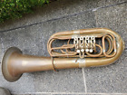 Old tuba (Bb?) with 4 rotary valves & garland. 