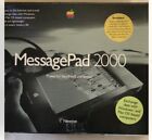 Newton/ Apple MessagePad 2000 with plug-in boards, battery, and charger