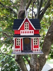 Red decorative wooden hand painted bird house