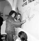 Claude Jade signs the wall of a restaurant during a party during t- Old Photo