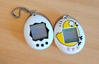 Vintage White Tamagotchi Digital Pet.  Functional with new battery!!