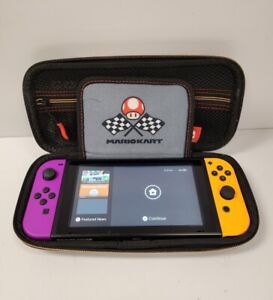 New ListingNintendo Switch - Neon Orange + Neon Purple Joy-Con With Mario Kart Case Used