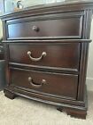 Medium Brown Bedside Table. Still in new condition. Three drawer compartment.