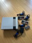 Nintendo NES Console With 2 Controllers, Power Cable, And Coaxial Tv Hook Up