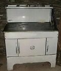 Antique kitchen stove. Coal or wood. Cast iron cook top.