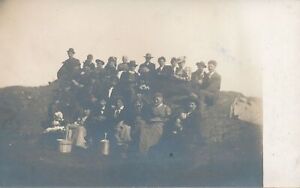 Adults and Child Sitting On Rock Real Photo Postcard rppc - udb (pre 1908)