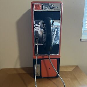 Vintage working Denver Broncos payphone