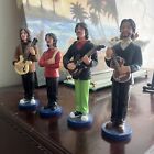 Beatles Figurines On The Rooftop