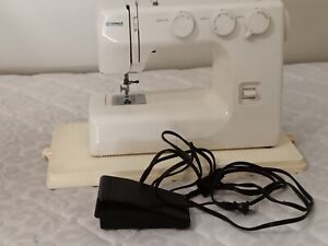 Kenmore sewing machine with cover, gently used, for sale in good condition