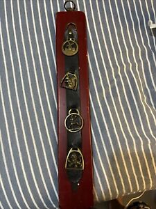 4 Vintage Brass Horse Medallions mounted to strap and wood panel