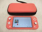 Nintendo Switch Lite Coral with Super Smash Bros Ultimate and Carrying Case