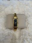 Vintage ladies gold with black face Gucci 1500L luxury dress bangle watch.