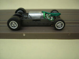 AFX RACING H.O. SCALE MEGA G+ 1.5 NARROW CHASSIS SILVER RIMS & SILVER SPINNERS