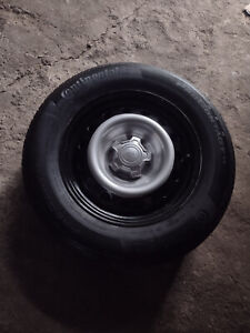 set of 4 ford maverick wheels and tires and spare tires
