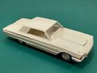 Up for auction is a white 1964 Ford Thunderbird promo car.