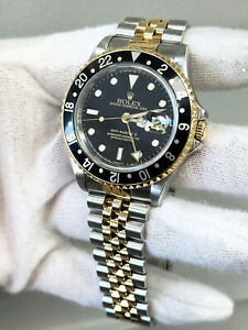 Rolex 16713 GMT Master II Black Dial 18K Yellow  Gold Stainless Steel Watch 40mm