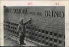1960 Press Photo A child reads Braille sign outside State School for the Blind
