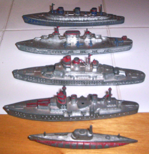 Five vintage Tootsie Toy Ships, 4 military, 1 civilian.