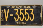2004 ARUBA LICENSE PLATE #V-3553 ONE HAPPY ISLAND. YELLOW AND BROWN