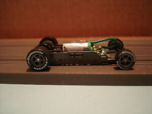 AFX RACING H.O. SCALE MEGA G+ 1.7 NARROW CHASSIS WITH GRAY 5 SPOKE RIMS LETTERED