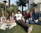 The Monkees Micky Dolenz Davy Jones sit in front yard 1970's 8x10 photo