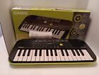 New ListingCASIO SA-46 Mini Electronic Keyboard Black & Green 32 Keys 100 Tones Piano/Organ