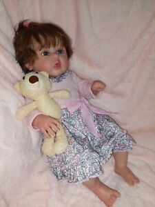 Reborn doll, Used but never played with. Comes with stuffed bear.