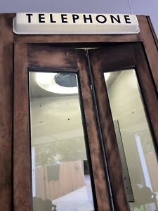 Vintage Western Electric Wooden phone booth working light and ceiling fan.