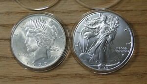 TWO BEAUTIFUL AMERICAN COINS- 1922 SILVER PEACE DOLLAR AND 2022 SILVER EAGE