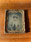 1/6th Size Tintype of young boy wearing hat in brass mat/frame hand tinted