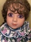My Twinn Cuddly Sister Rachel, 13” doll with brown hair and purple eyes.
