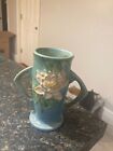 This stunning blue Roseville pottery vase, modeled as water lilies, is a true wo