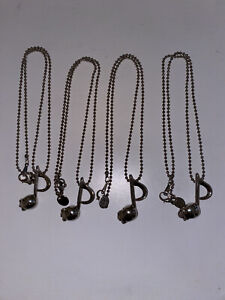 Four skull charm music note necklaces
