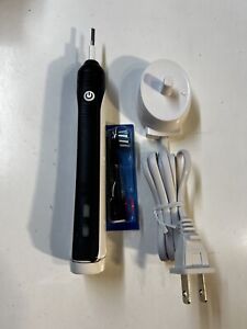 Black Oral-B Pro 1000 Electric Rechargeable Toothbrush Has Parts Read/ K