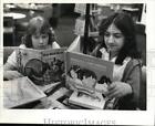 1981 Press Photo Children sort book for sale at North Royalton Public Library