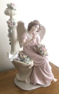 Member's Mark Painted Porcelain Angel Sitting with Ornate Flowers 13” Tall 7” W