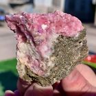 189G Mineral specimens of natural rhodochrosite coexisting with purple fluorite