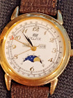 Men's Day/Date Moon Phase Selfix gold tone Watch. Preowned, some signs of wear.