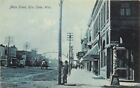 c1907 Postcard Rice Lake WI Main Street at Eau Claire St Business Signs Unposted