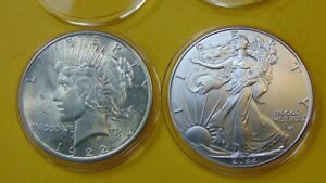 TWO BEAUTIFUL AMERICAN COINS- 1922 SILVER PEACE DOLLAR AND 2022 SILVER EAGE