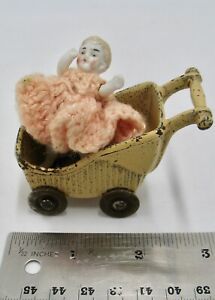 New ListingAntique Tiny Bisque Doll in Cast Iron Pram Stroller