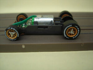 AFX RACING H.O. SCALE MEGA G+ 1.5 NARROW CHASSIS GOLD RIMS PAINTED CHROME & LETT