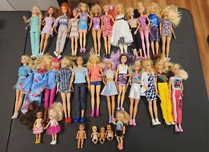 New ListingHuge Lot of 31 barbie dolls, clothes, accessories, pets, and more Very light use