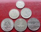 SIX ASSORTED SILVER COLOURED WORLD COINS / LOT 379
