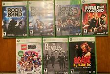 Lot of 7 XBox 360 Rock Band Games, good condition in original pkg with manuals