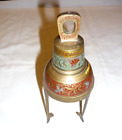 vintage engraved and painted brass bell on stand
