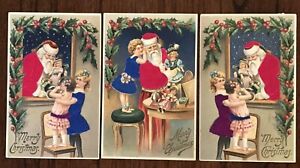 Quality ~Lot of 3~SILK SANTA CLAUS~with~Children~Dolls~Christmas~Postcards~h609